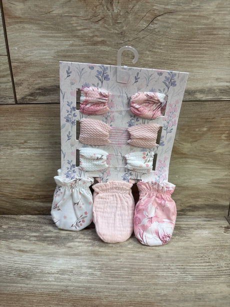 Front view of Ava Olivia 6pc headband and mittens set showcasing pink and white patterns on floral packaging