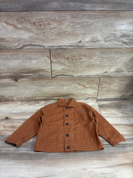 Brown Modern Moments button up shirt for toddlers size 3T on a wood background
