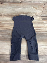 Back flat-lay of grey Cat & Jack Loved baby jumpsuit 6-9 months showing short sleeves and long legs with folded cuffs on wood background