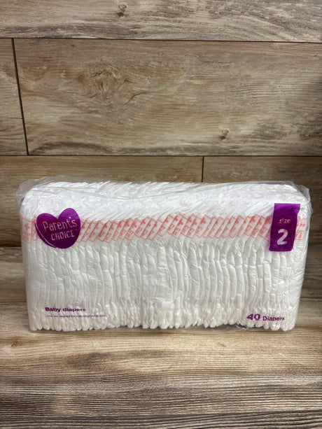 Package of 40 Me n Mommy To Be baby diapers, size 2, on a wooden surface.