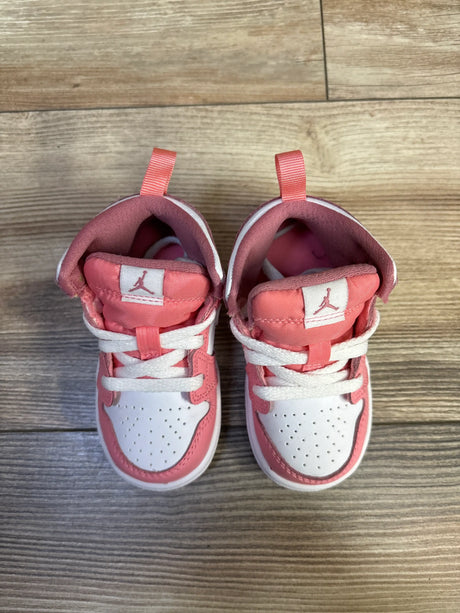 Top view of Jordan 1 Mid TD sneakers showcasing Coral Chalk, Desert Berry, and White panels with perforated toe boxes