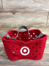 Red polka dot felt basket with white bullseye logo, gray handle, on wood floor