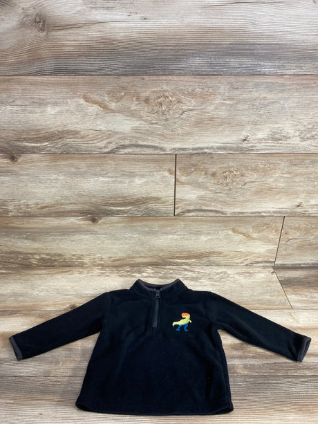 Black toddler fleece pullover with rainbow dinosaur embroidery on wood background