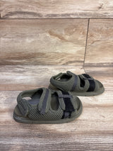 Three quarter view of toddler Zara scuba sandals size 7C showing green mesh upper, two Velcro straps and rubber sole on wood floor