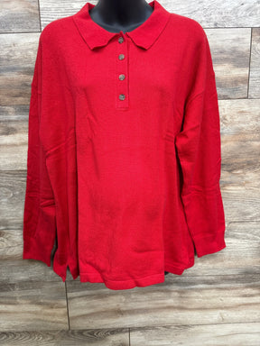 Red long-sleeve knit polo shirt with buttons on wooden background