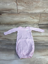 Flat lay of newborn pink Simple Joys sleep gown showing long sleeves, elastic gathered bottom, and small white embroidered bunny on wood background