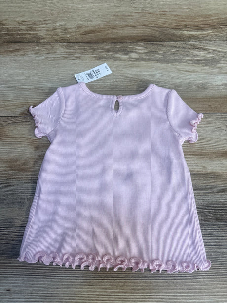 Back view of Baby Gap ribbed lettuce-trim baby shirt showing keyhole button, ruffled sleeves, and lettuce hem on wood background