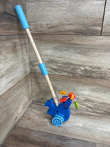 Blue wooden push toy for toddlers with colorful spinning beads on wheels