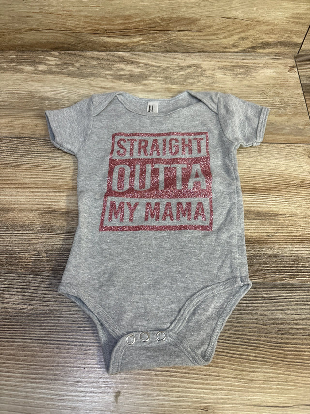 Top-down view of grey American Apparel baby bodysuit showcasing red glitter STRAIGHT OUTTA MY MAMA text with three metal snaps on wood-grain background