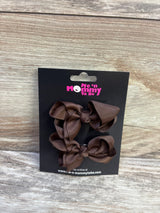 Front view of two brown grosgrain ribbon hair bows 2 pack on a black Me n Mommy To Be card against a wood background