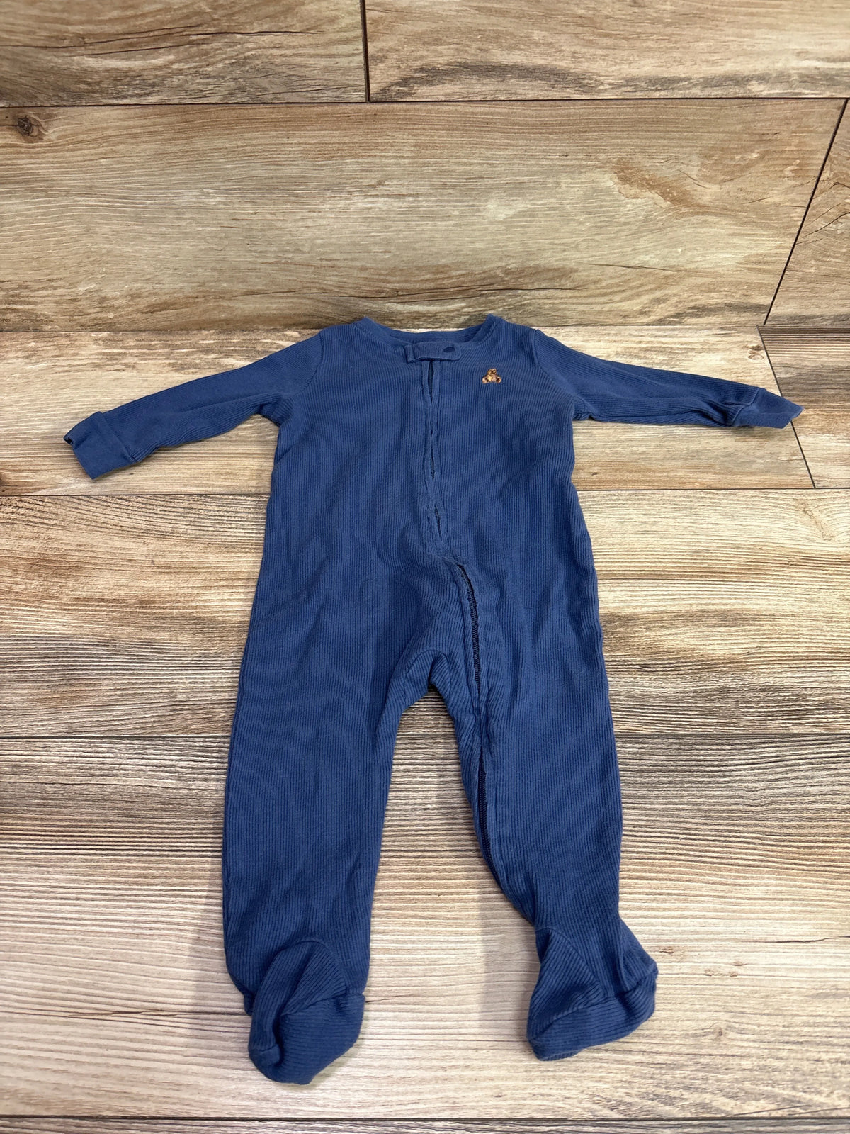 Blue ribbed baby sleeper by Me 'n Mommy To Be, size 3-6 months, on a wooden background.