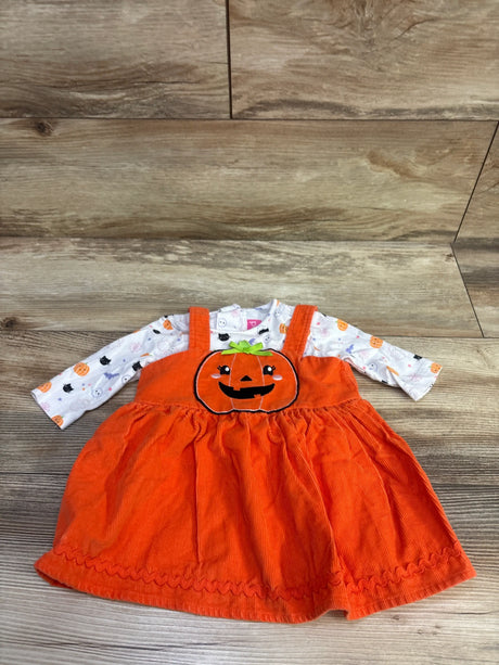 Front view of Goodlad Halloween shirt and orange corduroy skirtall set with pumpkin applique and printed sleeves