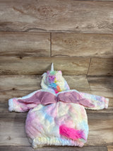 Flat lay of plush unicorn hooded pullover, size 6-12 months, with pastel fabric, horn, pink wings, and tail on wood floor