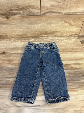 Kids denim jeans with elastic waist, rolled cuffs, on wooden floor