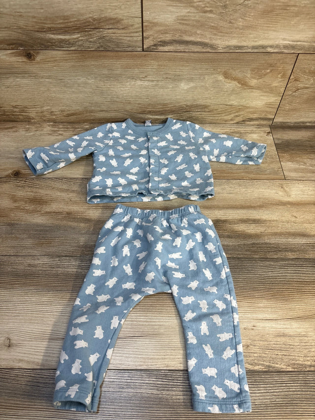 Blue baby outfit set with white bear print, includes long sleeve top and pants, laid flat on wood
