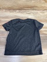 Back view of a grey Nike Dri-Fit short sleeve shirt for toddlers size 2T on a wooden background