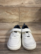Front view of Carter's Every Step Port sneakers in white with perforated toe, Velcro strap and elastic laces on wood floor