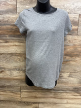 Front view of grey Isabel maternity shirt, large, short sleeves and round neck on black mannequin against wood background