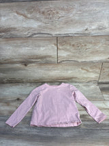 Flat lay of H&M toddler long-sleeve light pink shirt showcasing crew neck, long sleeves, and straight hem with wood floor background, size 3T