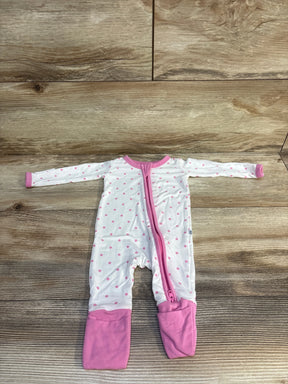 Pink polka dot baby onesie with zipper, laid flat on wood floor
