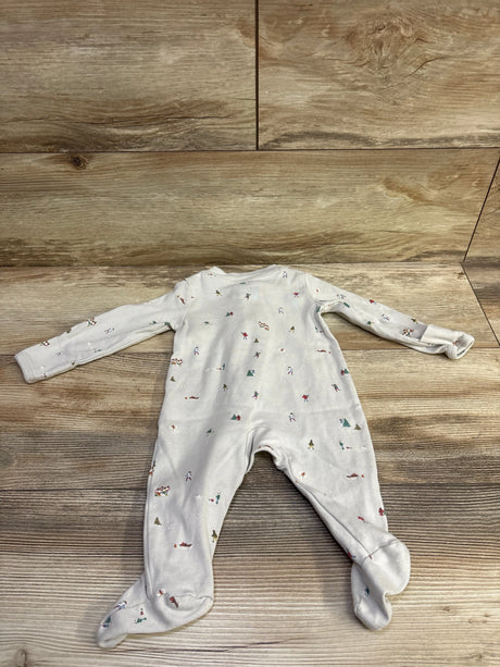 Front view of Little Planet Organic Holiday Sleeper in beige, showcasing long sleeves, footed legs, and holiday print