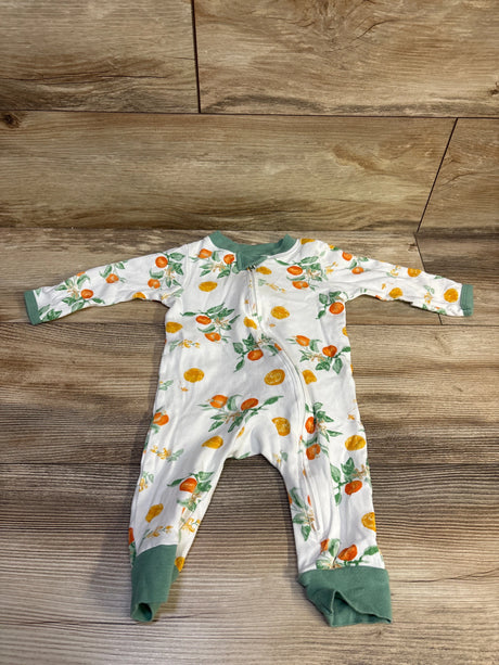 Front view of Burt’s Bees Baby organic sleeper in white with citrus print, front zipper, and green cuffs on wood flooring