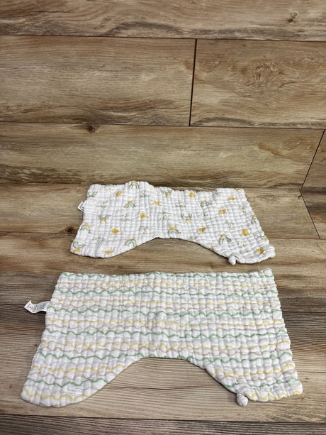 Top view of Neat Solutions 2pk muslin burp cloth bibs in white showcasing textured fabric and pastel patterns on wood