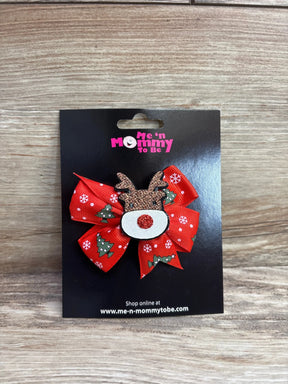Red Christmas bow with reindeer face, snowflakes, and trees for kids' holiday outfits