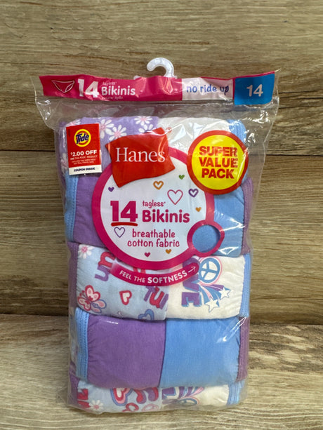 Front view of Hanes girls’ 14-pack tagless bikinis showing breathable cotton fabric and purple and blue patterns on wood