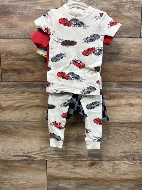 Front view of toddler 4-piece race car pajama set with white car-print top and pants, red tee, and checkered shorts on wood floor
