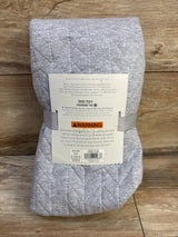 Folded front of Cloud Island changing pad cover in grey showing quilted stitching and size 32x17x7 in on wood