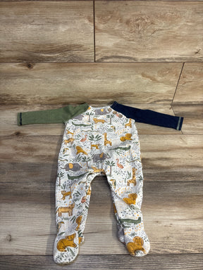 Front view of Mud Pie footed coverall with safari animal print and contrasting green and navy sleeves on wood background