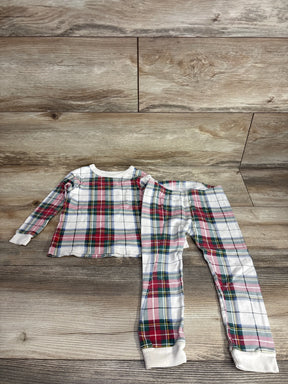 Kids plaid pajama set with red, green, and blue pattern on wood floor