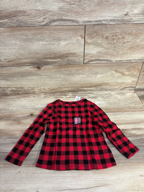 Red and black plaid long sleeve toddler shirt on wood background