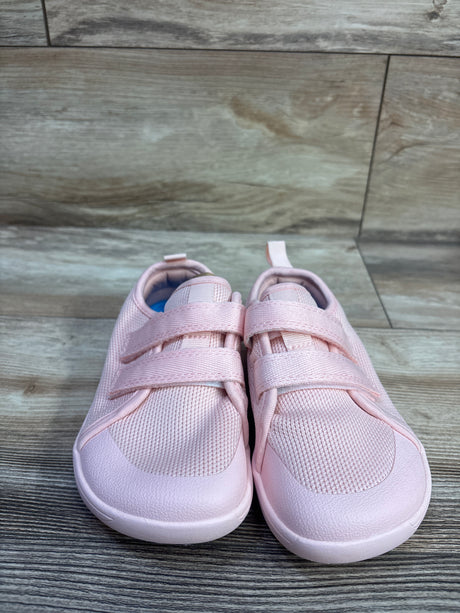 Front view of pink NEW WHITIN wide barefoot sneakers showcasing two hook-and-loop straps on a wood-look floor