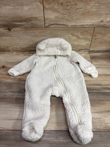 Front view of H&M ivory sherpa hooded bunting in size 6 months showcasing covered feet and front zipper on wood flooring
