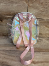 Iridescent kids backpack with pink straps and butterfly wing accents on wood floor