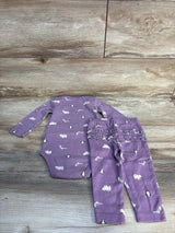 Purple baby outfit set with animal print, long sleeve bodysuit and ruffle pants on wood floor