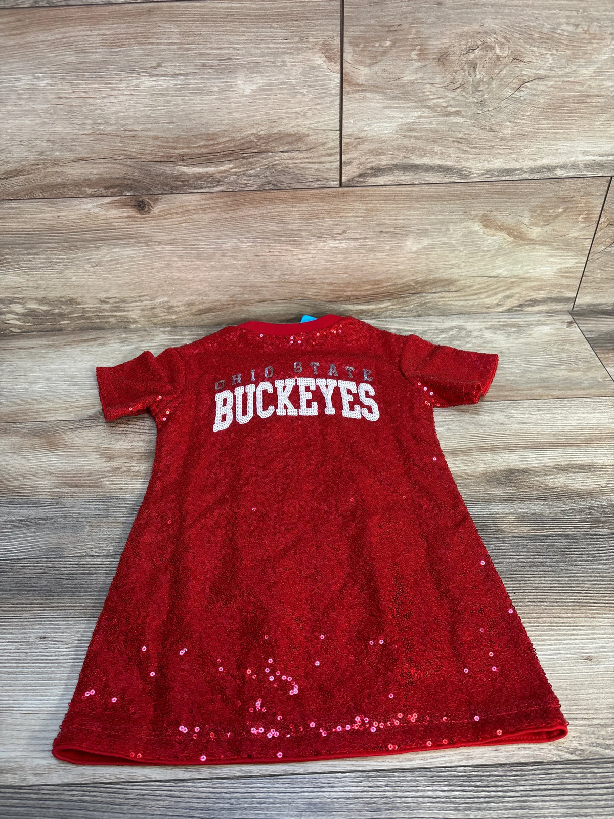 Red sequined Ohio State Buckeyes kids dress on wood background