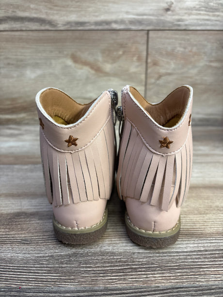 Rear view of pink toddler cowgirl boots showing fringe and embroidered star detail on wood plank background
