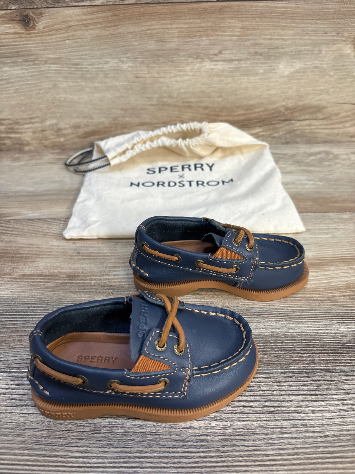 Navy blue Sperry toddler boat shoes with tan laces and stitching, Nordstrom dust bag