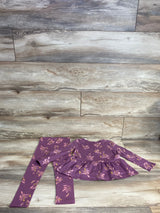 Purple long-sleeve floral baby outfit with matching leggings on wooden floor background