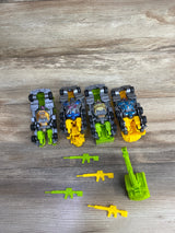 Four toy robot cars with yellow and green bases and small green and yellow toy guns on wood surface