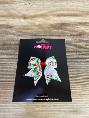 White Christmas bow with red and green 'Merry Christmas' print, perfect for kids' holiday outfits.