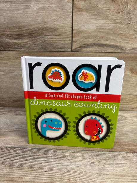 Front view of Roar dinosaur counting board book showing feel-and-fit dinosaur shapes inset and colorful cover on wooden tabletop background