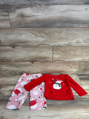 Children's holiday pajama set with red long-sleeve top featuring snowman and pink pants with snowman pattern