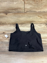 Front flat-lay of Old Navy nursing sports bra showing wide straps with nursing clip and longline band on wood background