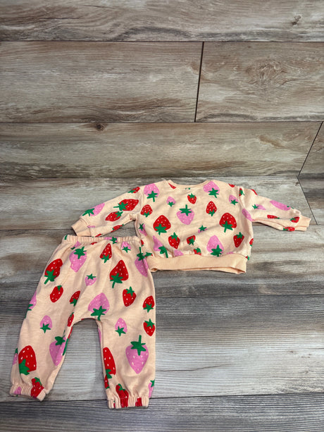 Top-down view of Old Navy 2-piece pullover sweatshirt and joggers set with strawberry print and ribbed cuffs on a wood-look floor