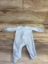 Top view of Carters blue ribbed sleeper in size 3 months showcasing long sleeves and attached feet with a wood-grain background