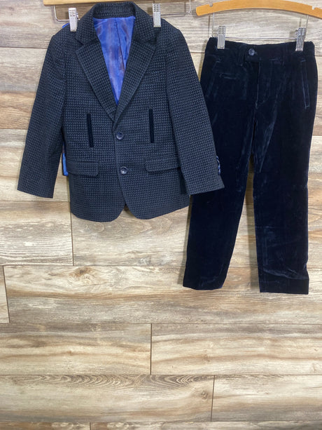 Kids black check blazer and velvet dress pants set on wooden background